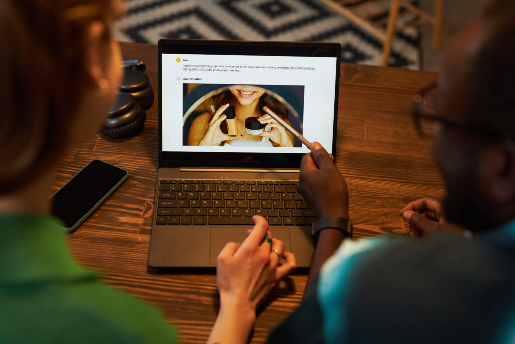 colleagues discussing image on laptop in team